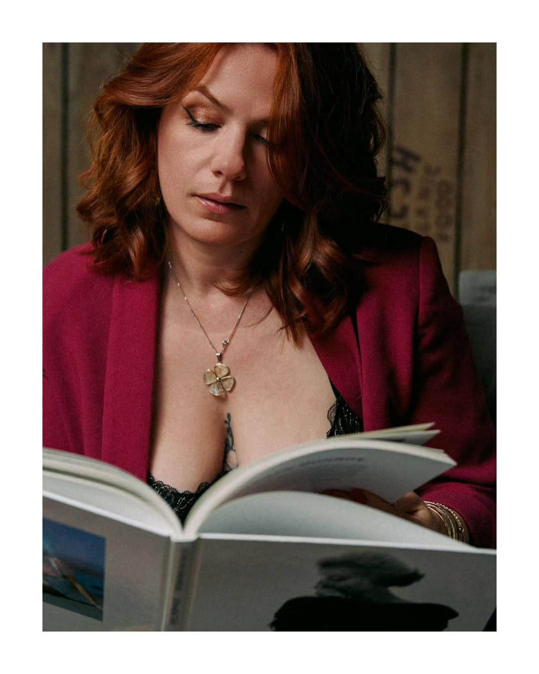 Editorial portrait of Rousse se Rebelle reading a book