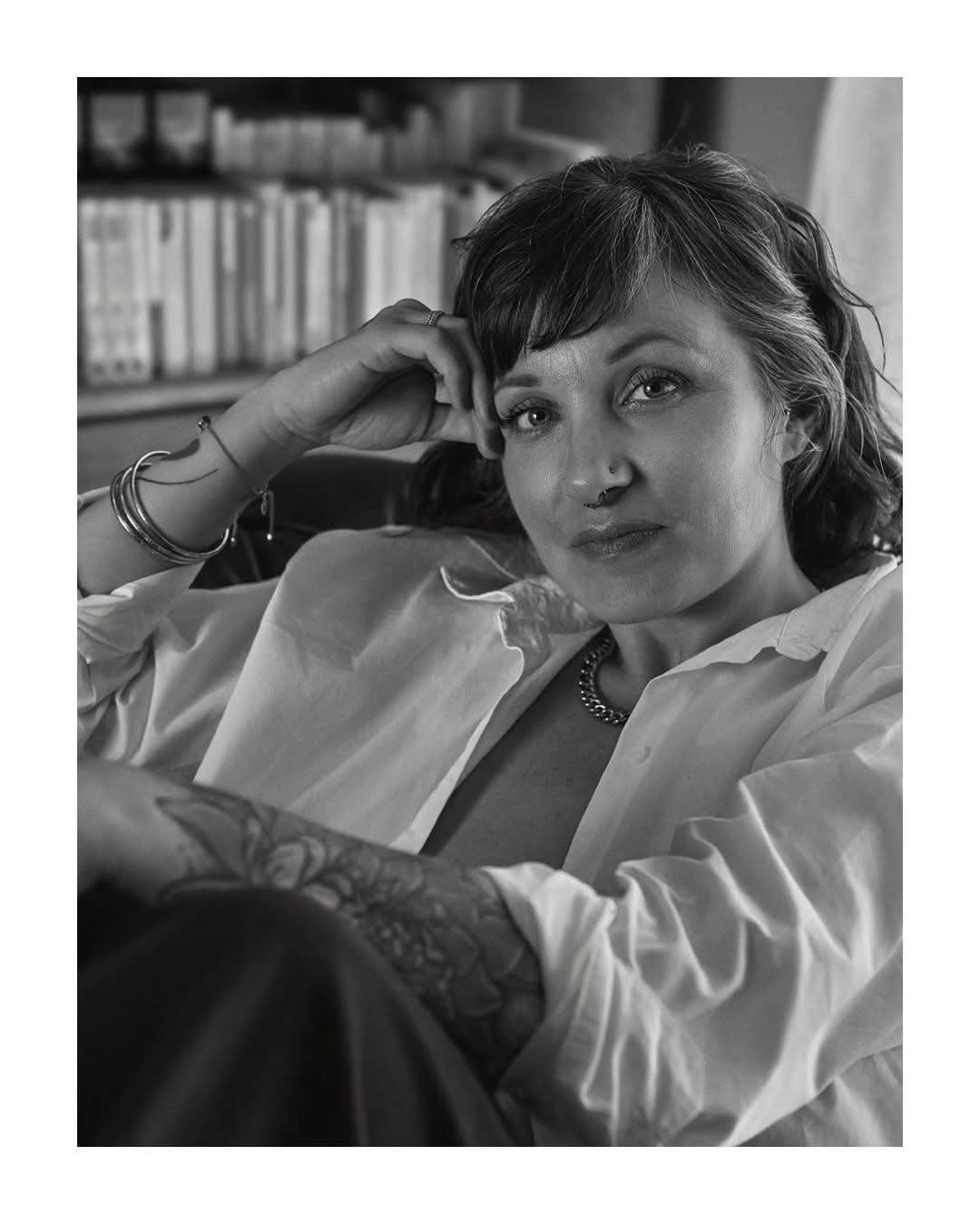 Black-and-white portrait of Deva in a white shirt